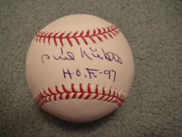 Phil Niekro Autographed Official MLB Baseball With HOF 97 ins. With PSA COA