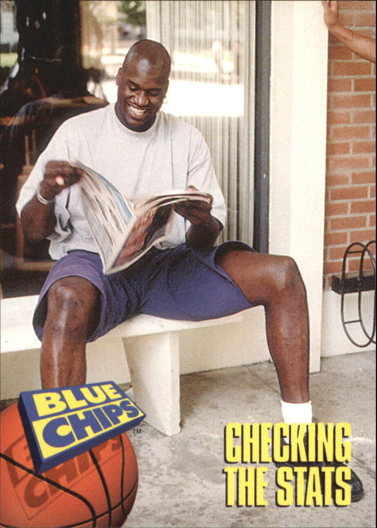 1994 SkyBox Premium Blue Chips #84 Checking the Stats/(O'Neal reading/sports magazine)