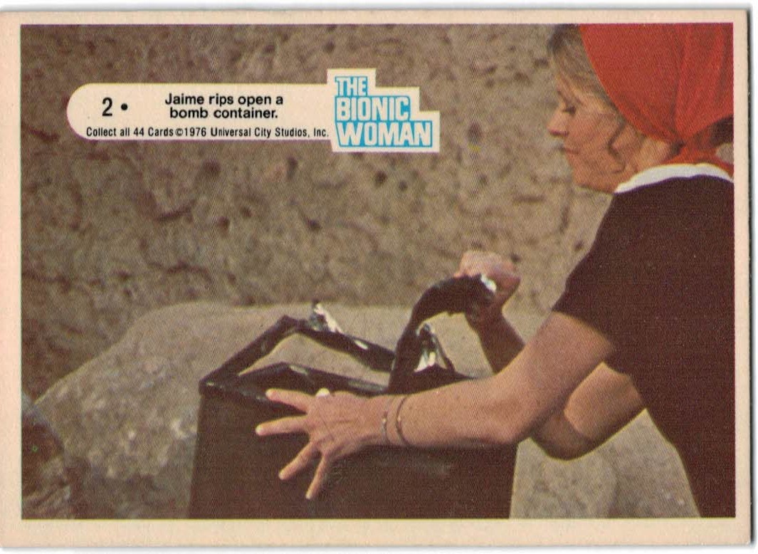 1976 Donruss Bionic Woman #2 Jamie Rips Open a Bomb Container.