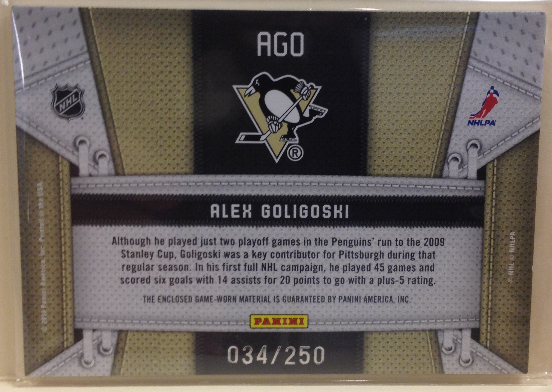 2010-11 Certified Fabric of the Game #AGO Alex Goligoski back image